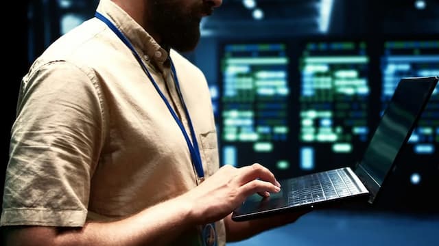 Man using laptop to access proxy server in organization